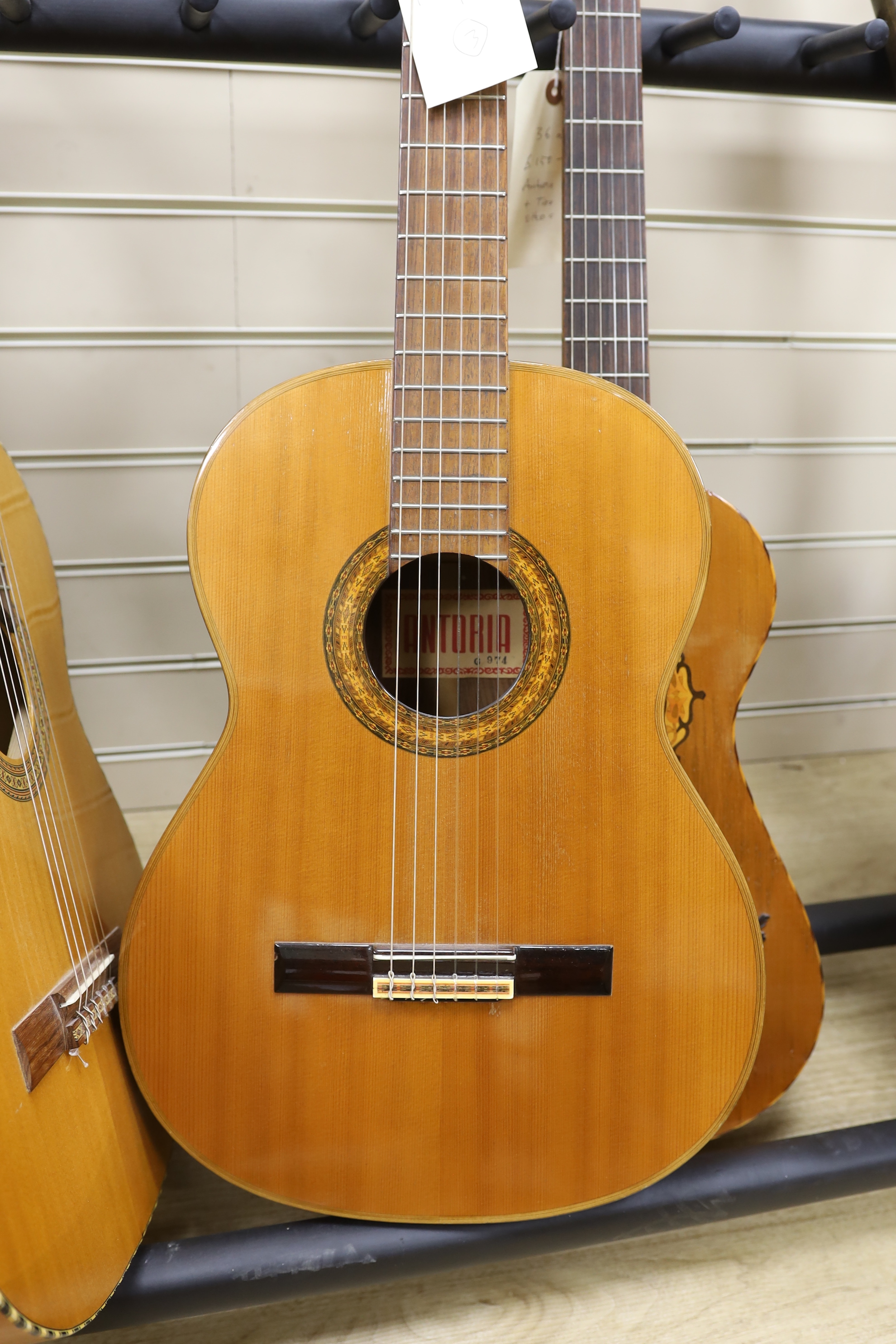 An acoustic guitar, labelled internally Antoria G 974 and two others